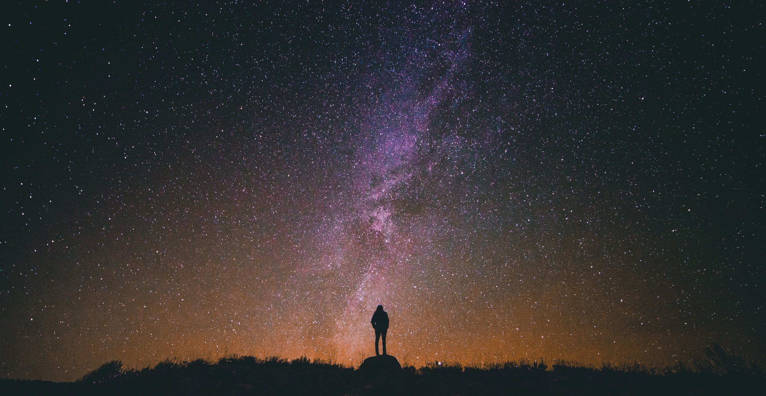 Man standing under the stars